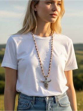 Long Brown Beaded Necklace with Gold Bull Pendant